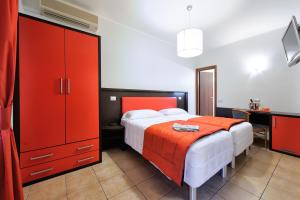 Postel nebo postele na pokoji v ubytování Hotel al Corso