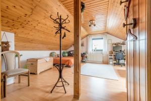 a bedroom with a bed and a wooden ceiling at Private Room in Harsum