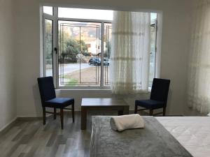 Кровать или кровати в номере Suluca Homes +37 фотографий
