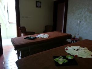 a room with two beds with bowls on top of them at Grand Eliana Hotel Conference & Spa in Addis Ababa