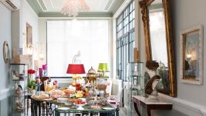 a room with a table filled with food and other items at Villa Belverde Boutique Hotel in Carrara