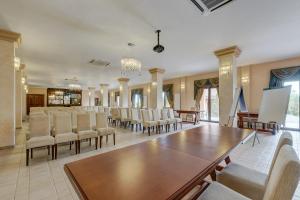 a large room with a long table and chairs at Club Insieme Grand Resort in Potlogi +61 photos