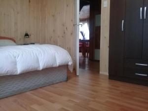 מיטה או מיטות בחדר ב-Wool & Wood House