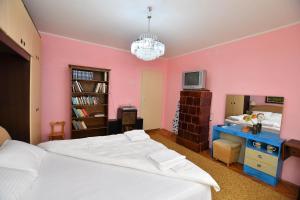 Postel nebo postele na pokoji v ubytování Kaza apartment
