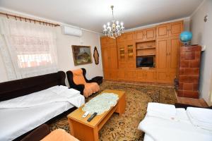 Postel nebo postele na pokoji v ubytování Kaza apartment