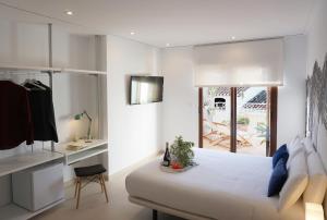Postel nebo postele na pokoji v ubytování Mardenit Hotel Boutique