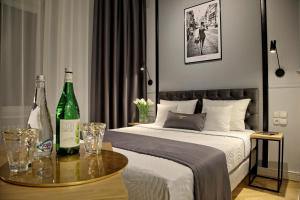 Łóżko lub łóżka w pokoju w obiekcie Bentis Luxury Apartments