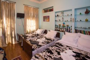a room with two beds and a window at Urban 1861 in Tbilisi City