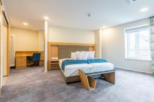 Ένα ή περισσότερα κρεβάτια σε δωμάτιο στο Schwan und Post Business Quarters