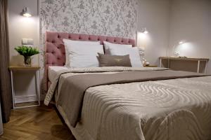 Łóżko lub łóżka w pokoju w obiekcie Bentis Luxury Apartments