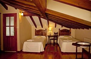 Cama o camas de una habitación en El Camino Real II *