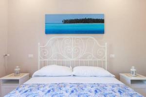 Postel nebo postele na pokoji v ubytování B&B Miccio