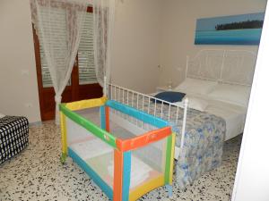 Postel nebo postele na pokoji v ubytování B&B Miccio
