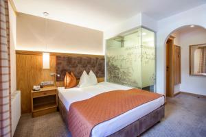 Krevet ili kreveti u jedinici u okviru objekta Hotel Mariasteinerhof