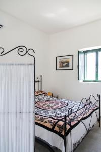 Postel nebo postele na pokoji v ubytování Physis b&b-a casa di Clio