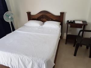 Voodi või voodid majutusasutuse Hotel Palmari toas