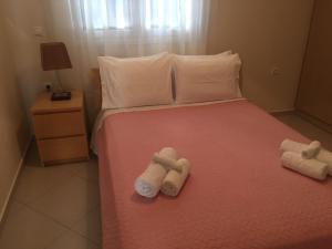 Llit o llits en una habitació de Eleni Apartment