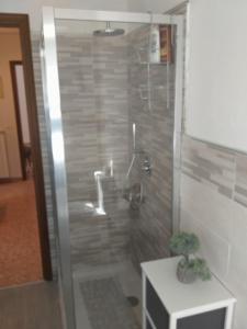 a bathroom with a shower with a sink at La Casa di Zoe - Terre del Magra in Bocca di Magra +14 photos