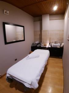 Postel nebo postele na pokoji v ubytování Hotel Aurora e del Benessere