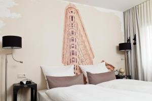 Postel nebo postele na pokoji v ubytování Best Western Hotel Nürnberg am Hauptbahnhof