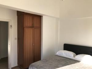 Кровать или кровати в номере Suluca Homes