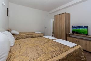 Ένα ή περισσότερα κρεβάτια σε δωμάτιο στο Upper Gate Apartments