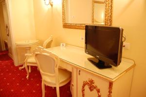 TV a/nebo společenská místnost v ubytování Hotel Motel Gold