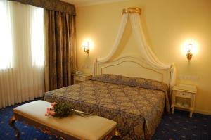 Postel nebo postele na pokoji v ubytování Hotel Motel Gold
