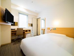 Postel nebo postele na pokoji v ubytování Super Hotel Asakusa