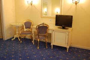TV a/nebo společenská místnost v ubytování Hotel Motel Gold