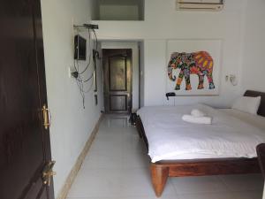 Postel nebo postele na pokoji v ubytování Pushkar Vela Resort