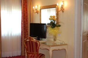 TV a/nebo společenská místnost v ubytování Hotel Motel Gold