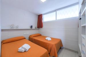 Posteľ alebo postele v izbe v ubytovaní Rentalmar Navarra family suites + 23 fotografií