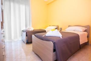 A bed or beds in a room at Etna Sunshine