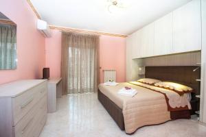 A bed or beds in a room at Etna Sunshine