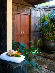 a towel sitting on a block in front of a door at Rico Resort in Chiang Kham