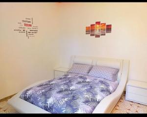 Un pat sau paturi într-o cameră la Casa Vacanza DaRó