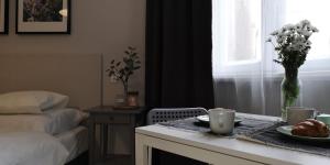 Posteľ alebo postele v izbe v ubytovaní Glam House Apartments