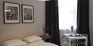 Posteľ alebo postele v izbe v ubytovaní Glam House Apartments
