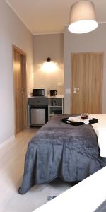 Posteľ alebo postele v izbe v ubytovaní Glam House Apartments