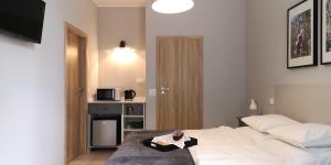 Posteľ alebo postele v izbe v ubytovaní Glam House Apartments