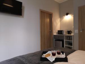 Posteľ alebo postele v izbe v ubytovaní Glam House Apartments