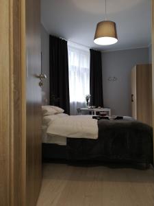 Posteľ alebo postele v izbe v ubytovaní Glam House Apartments
