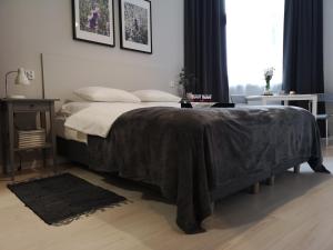 Posteľ alebo postele v izbe v ubytovaní Glam House Apartments