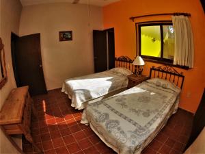 Postel nebo postele na pokoji v ubytování Quinta Comala Hotel & Villas