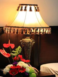A bed or beds in a room at Kong Garden View Resort Chiang Rai