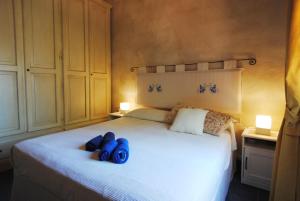 A bed or beds in a room at Acquamarina - Exclusive Sea House
