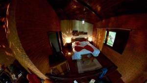 Cama ou camas em um quarto em Vista Linda Hotel