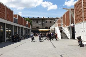a group of people riding bikes on a street at Casa Ferrari Testaccio e Trastevere Wi-Fi free in Rome