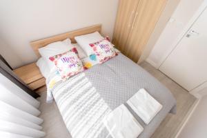 Postel nebo postele na pokoji v ubytování Resort Apartamenty Klifowa Rewal 19